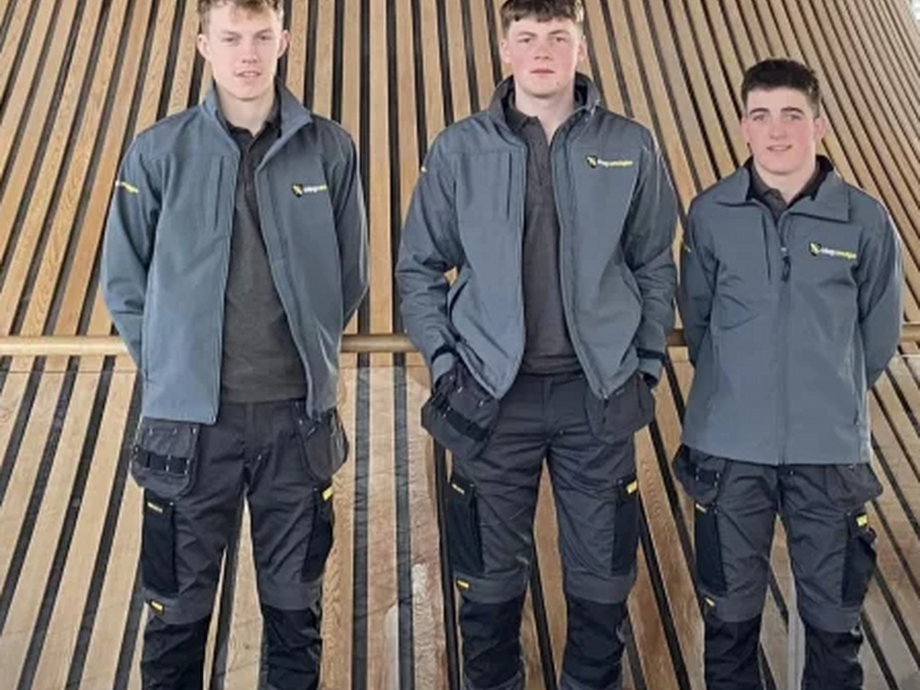 Three construction students in the Senedd