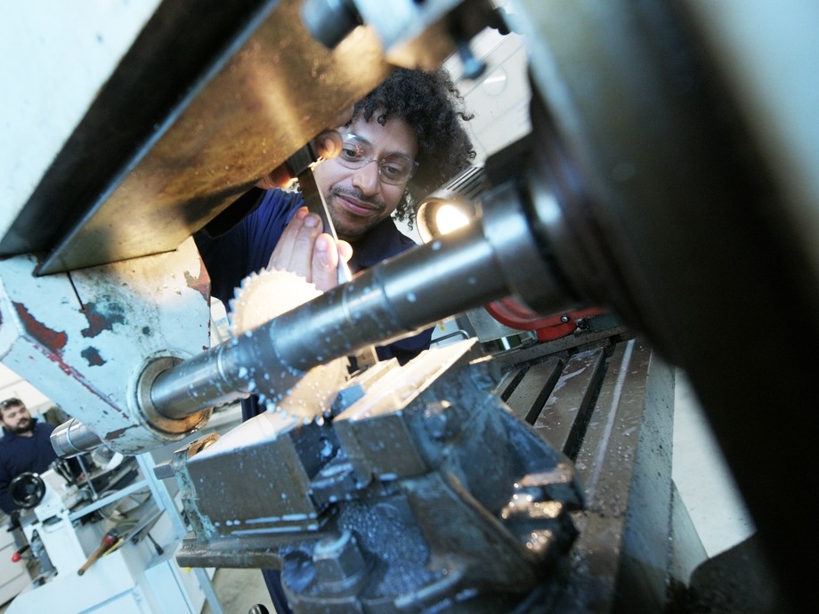 Student working with engineering machinery