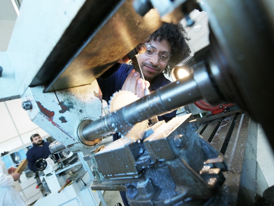 Student working with engineering machinery