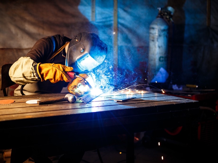 Student welding in full PPE