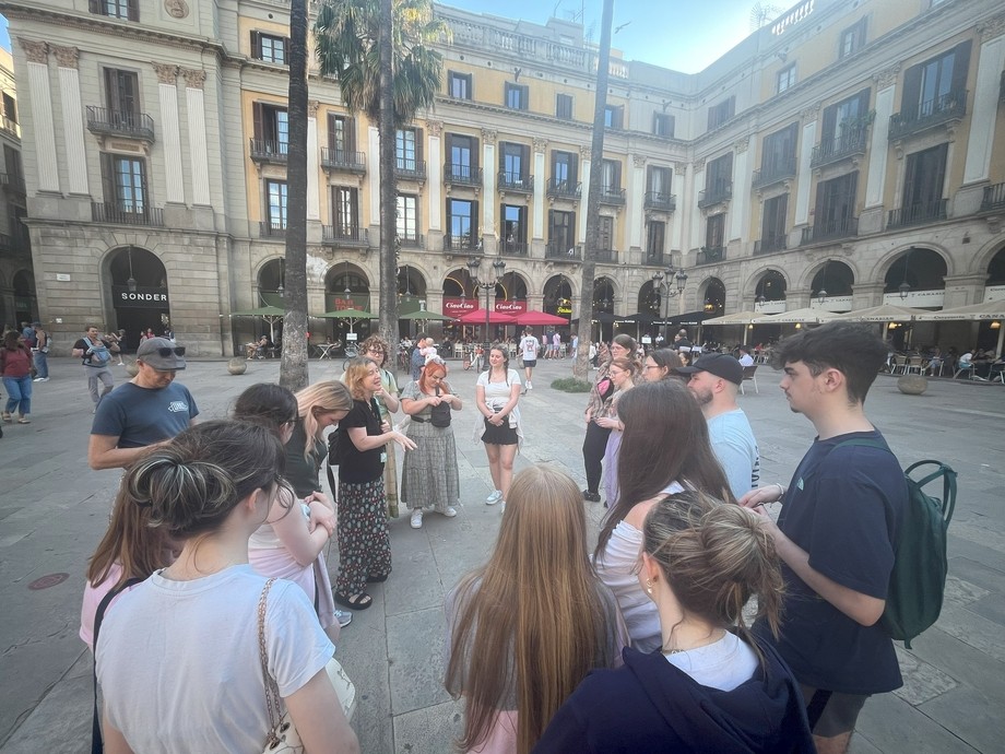 The group pictured in a square of the city 