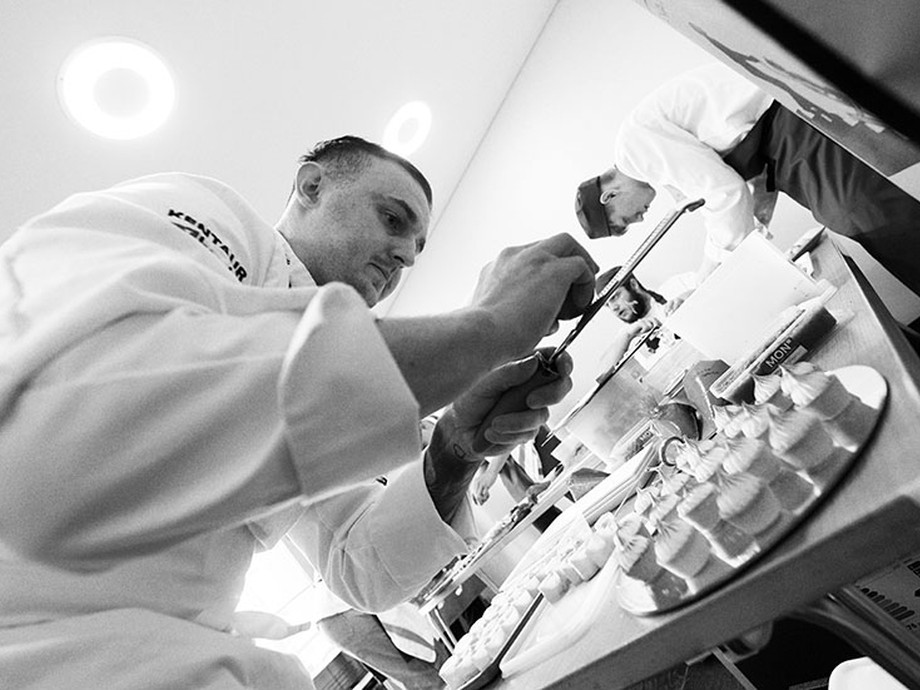 Lecturer working in the Senedd kitchen