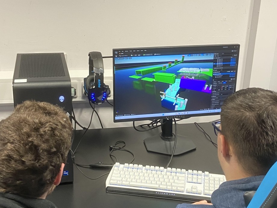 Two young people sitting and gaming watching the screen