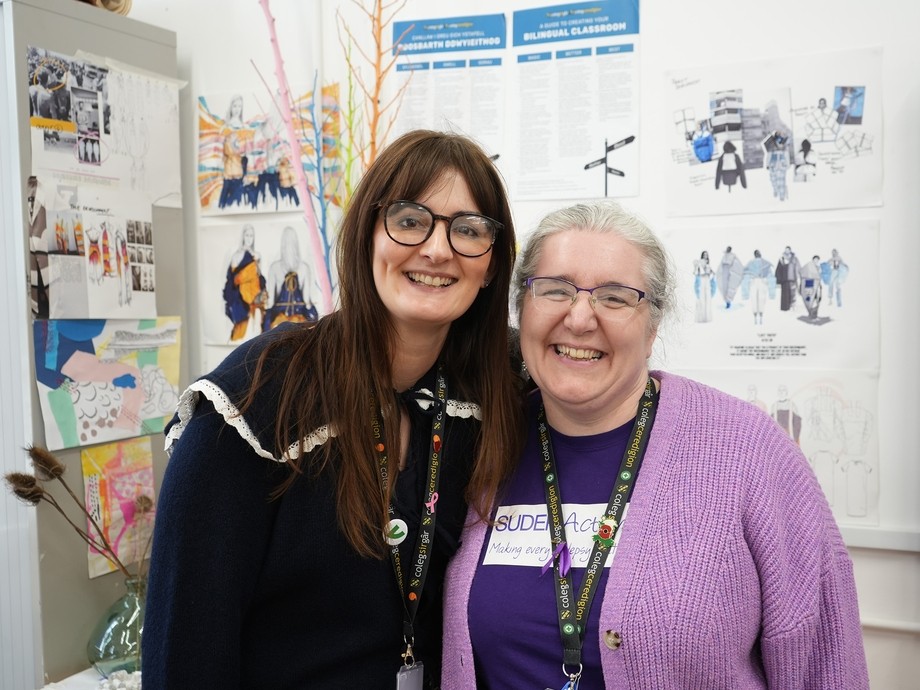 Rebecca Sellick standing next to Helen Yates who is wearing Purple Day branding