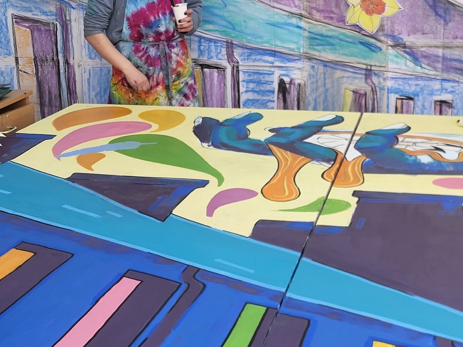 a student working on a large board