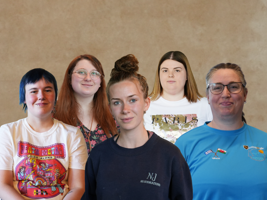 All the students involved in a row looking at the camera