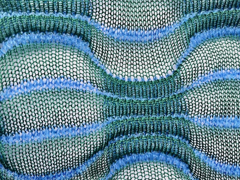 An array of blues and greens stringy weave design. Tegan James Double Bed Mercerised Cotton and Mohair