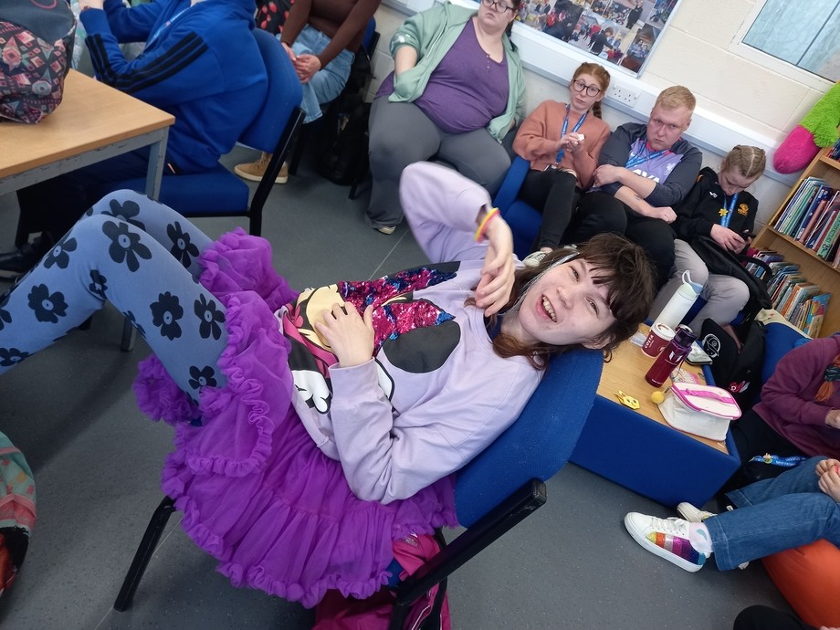 A student dressed all in purple