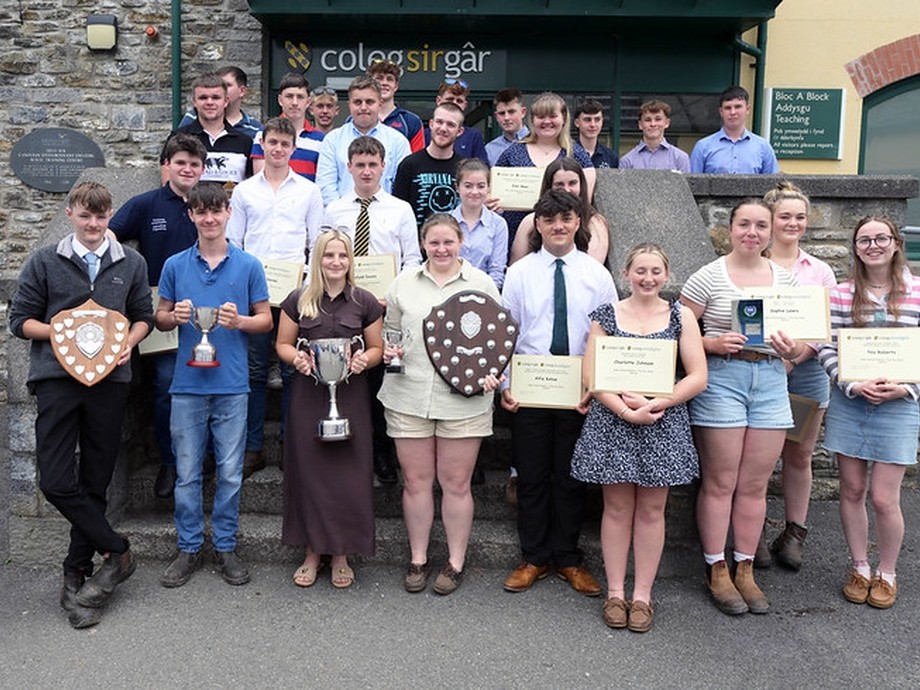 A group of award winners outside the campus