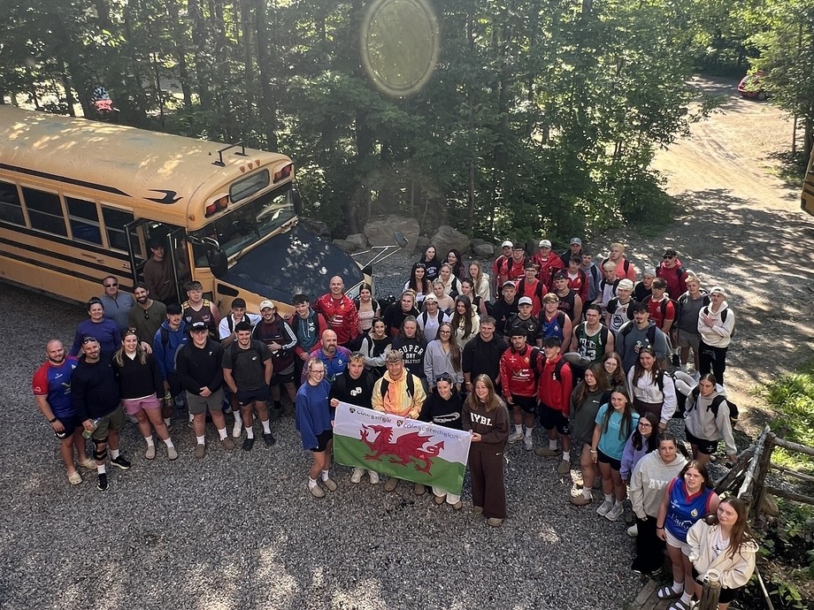 An ariel photo of students outside their yellow bus