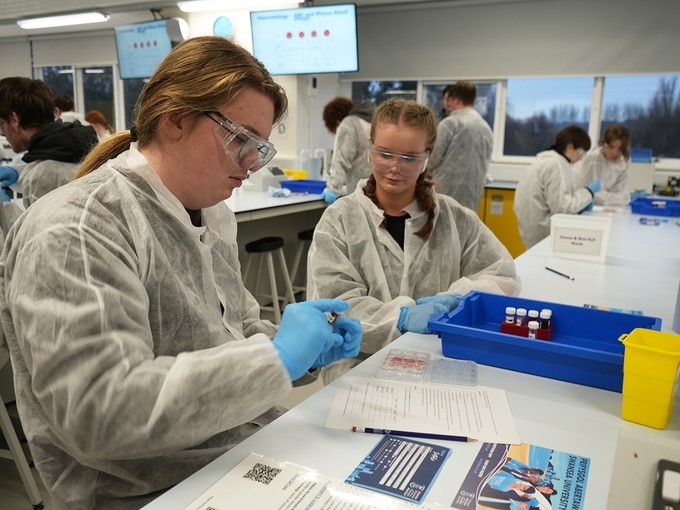 Two students working in a lab