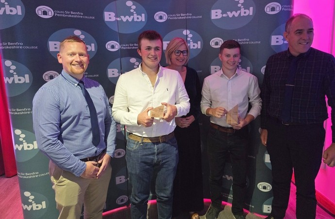 A row of learners with construction lecturers at the awards