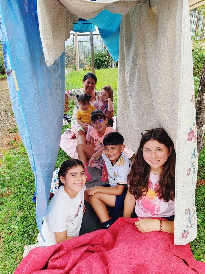 Hannah with her Costa Rican family in a home made den
