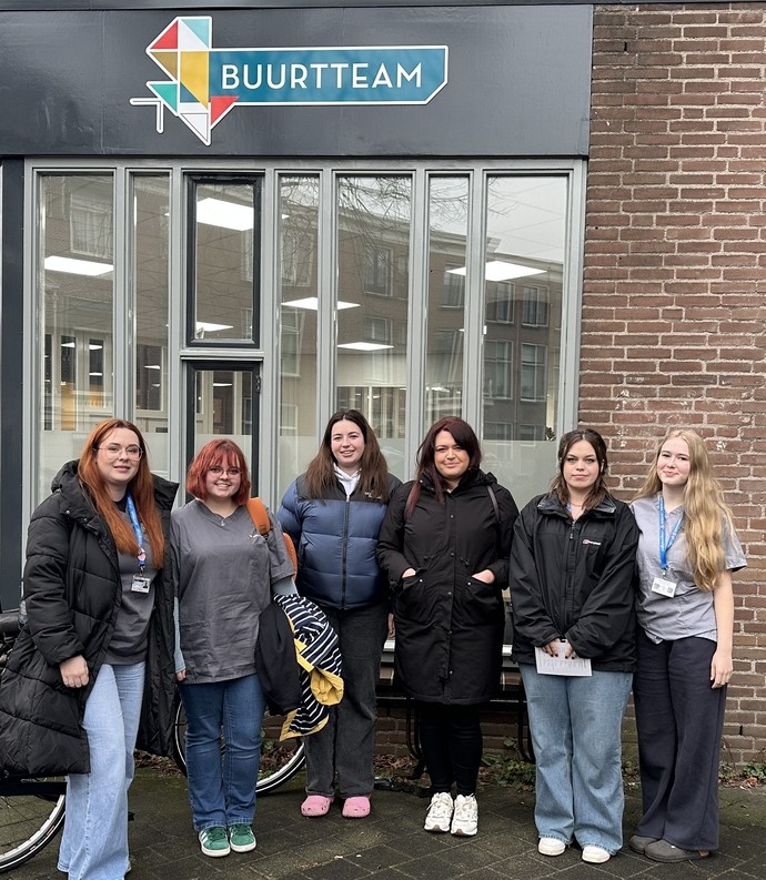 The students outside in the Netherlands standing for a photo 