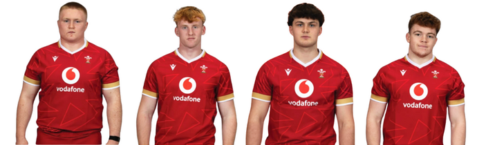 A row of rugby players facing the camera all in red shirts