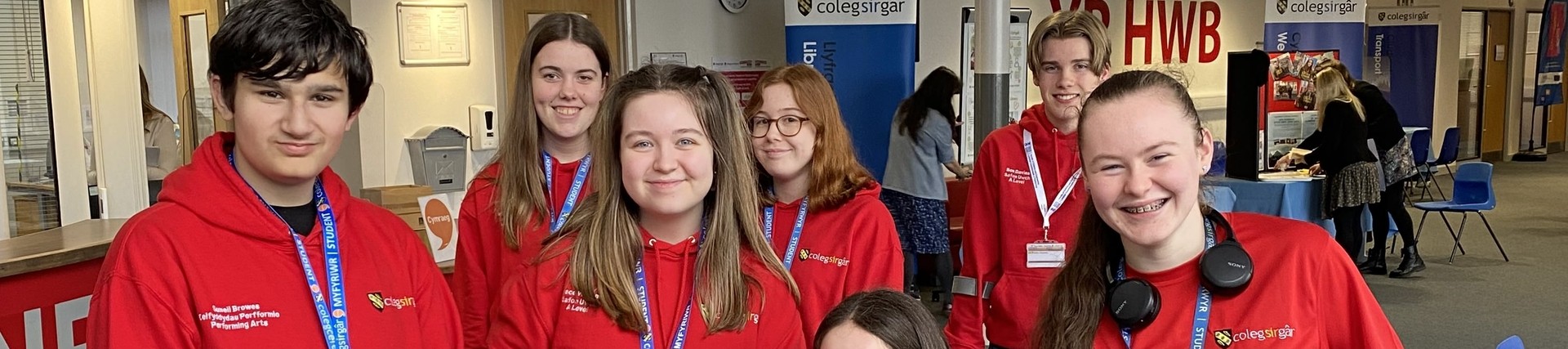 A group of student ambassadors in their red ambassador hoodies.