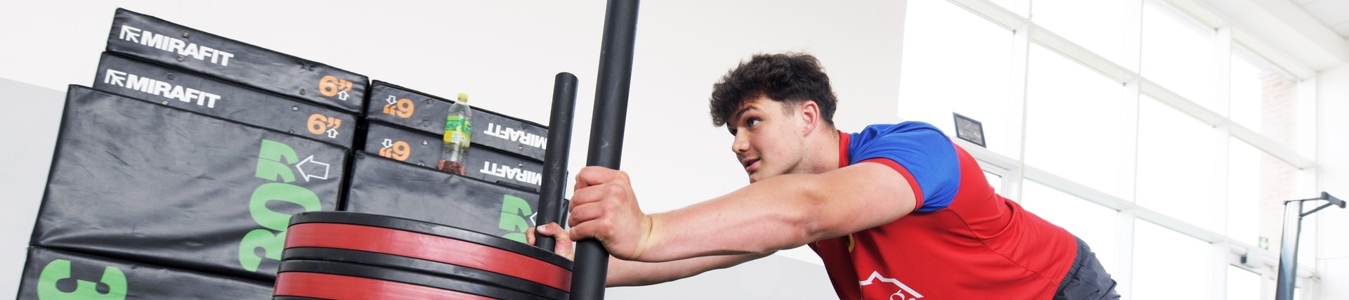 A student works on his fitness in the gym.