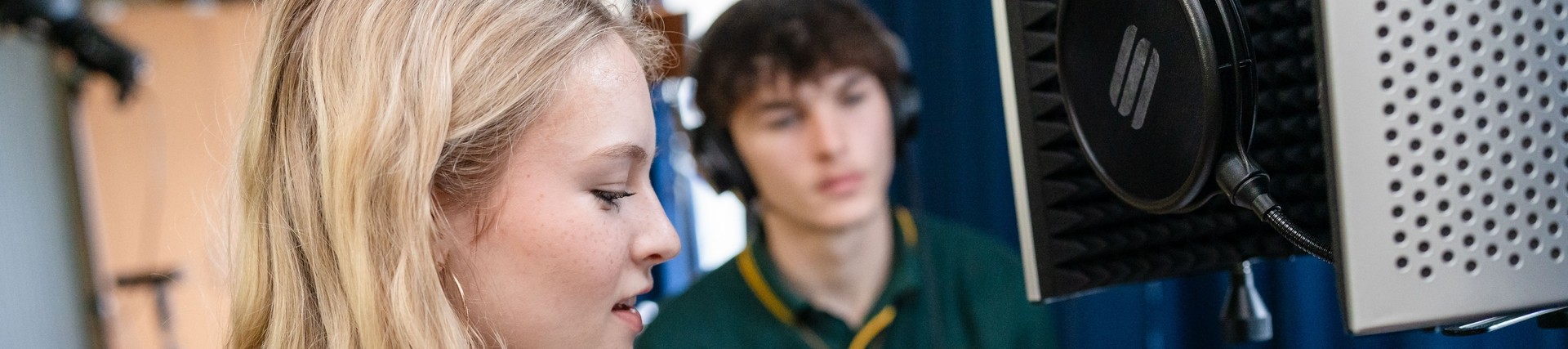A student doing a vocal take.