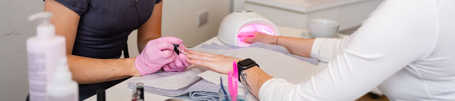Student giving manicure