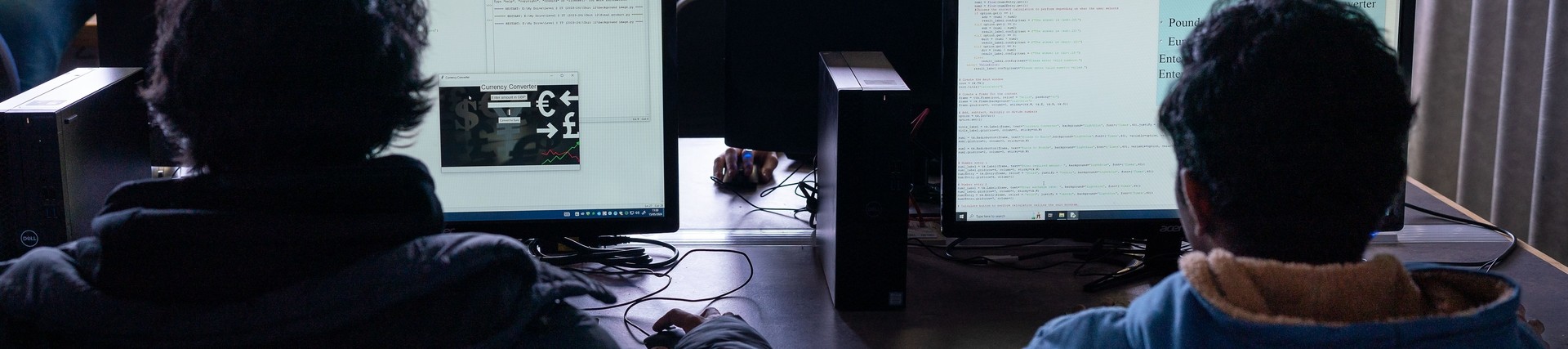 two students sat at computers