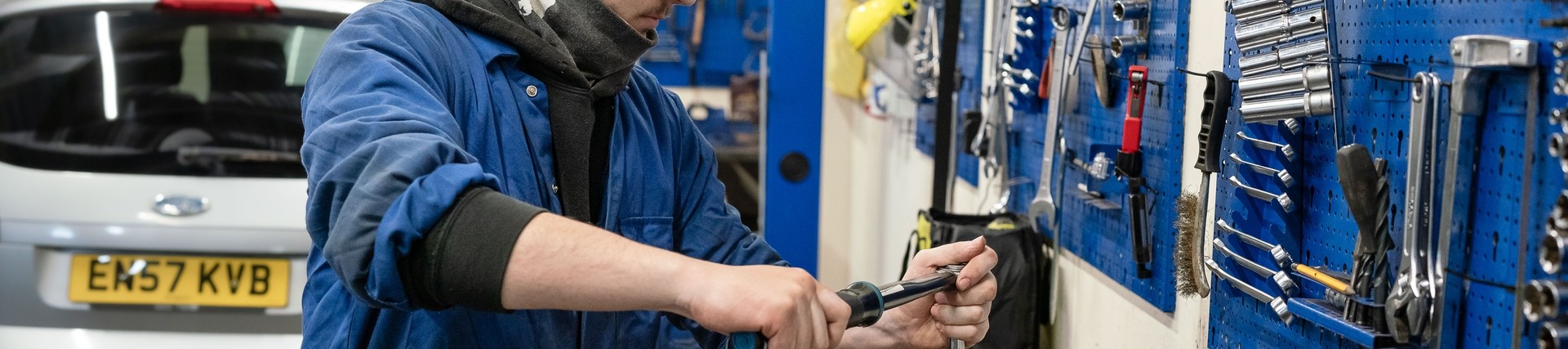 Student working on car part 