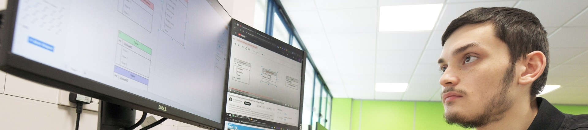 A student developing code on a computer.