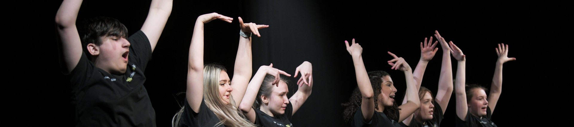 Students dancing in a line.