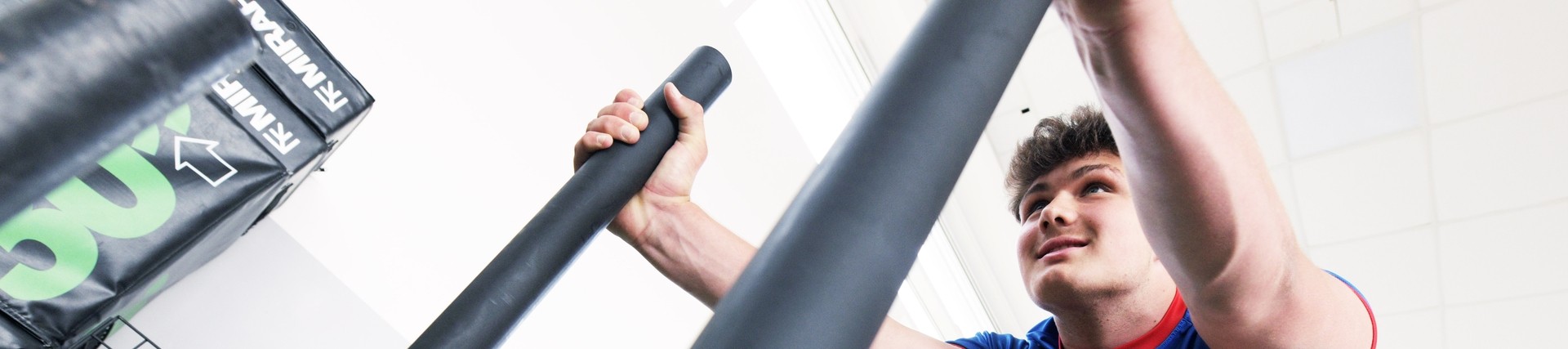 A student working out in the gym.