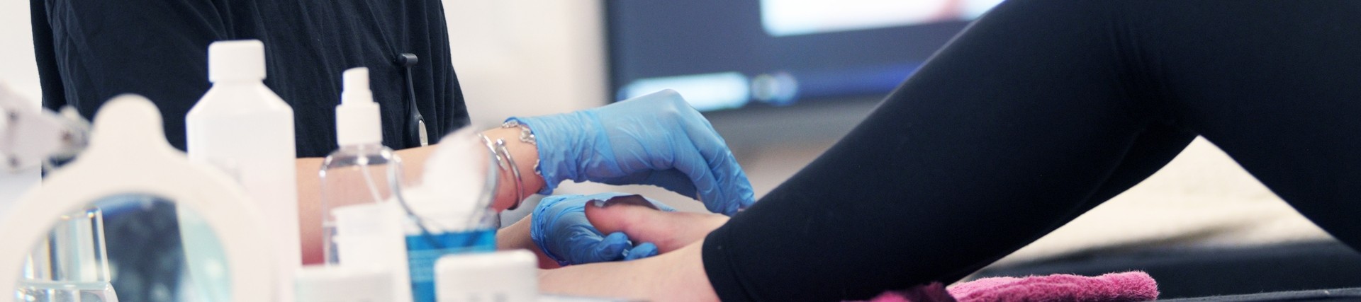 A student does a pedicure. 