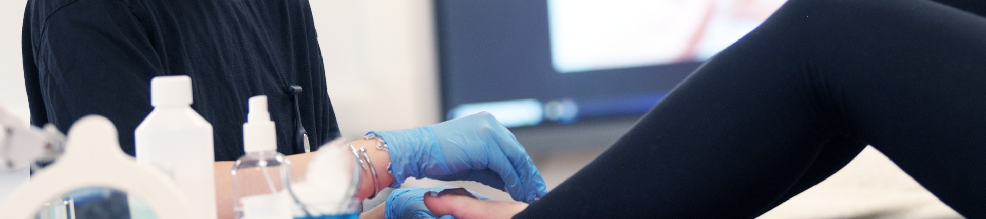A student does a pedicure. 