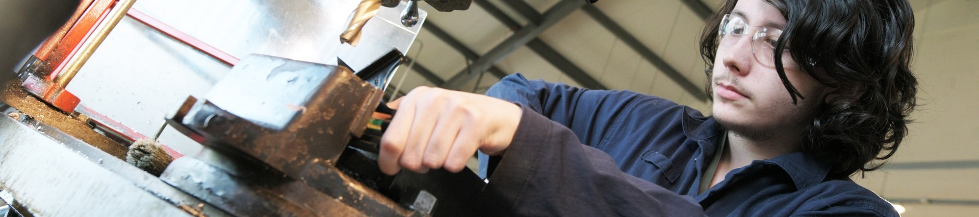 A student using a drill.