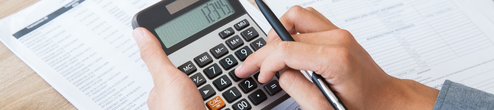 A student using a calculator. 