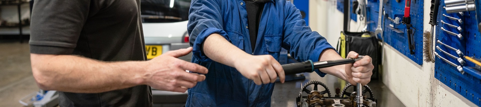 Tutor teaching vehicle maintenance