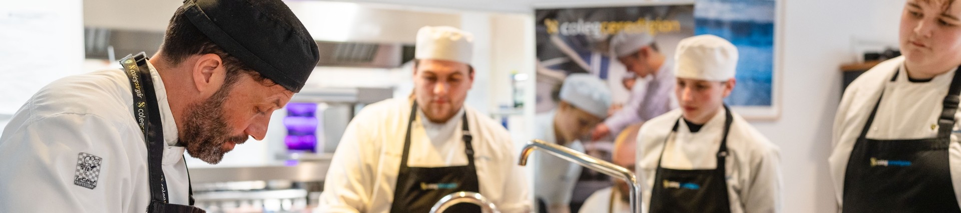 Lecturer teaching in a training kitchen