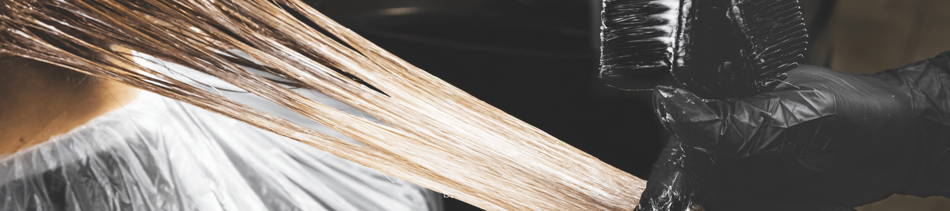 someone pulling a section on blond hair 