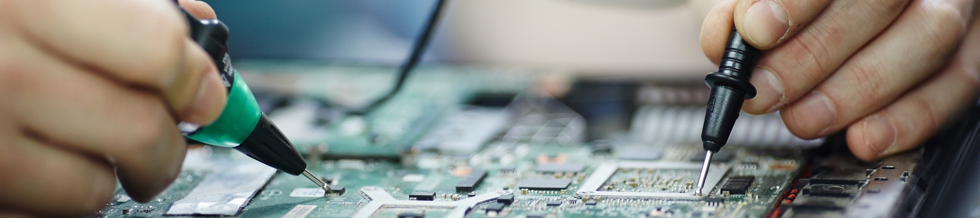 close up checking-current-laptop-circuit-board