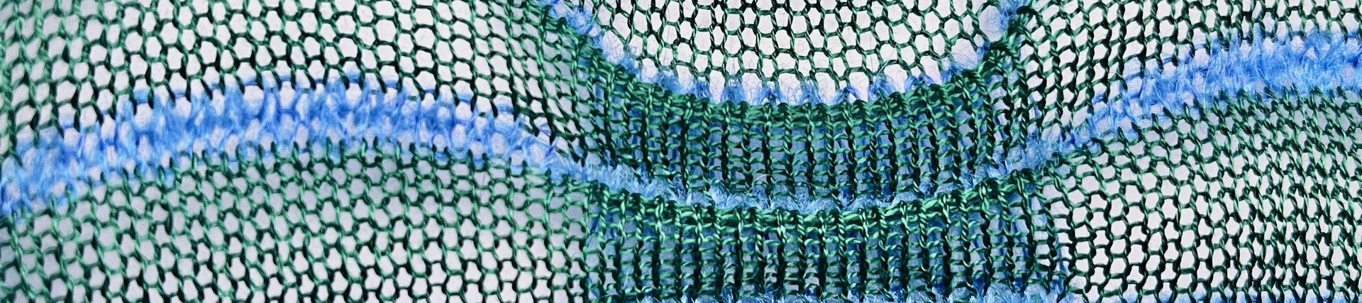 An array of blues and greens stringy weave design. Tegan James Double Bed Mercerised Cotton and Mohair