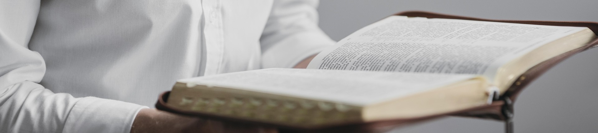 man reading a holy book