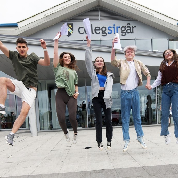 A group of students jumping in the air.