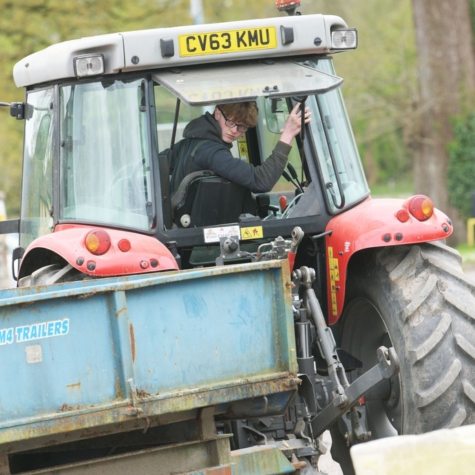 A student reversing his tractor.