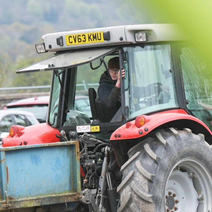 A student reversing his tractor.