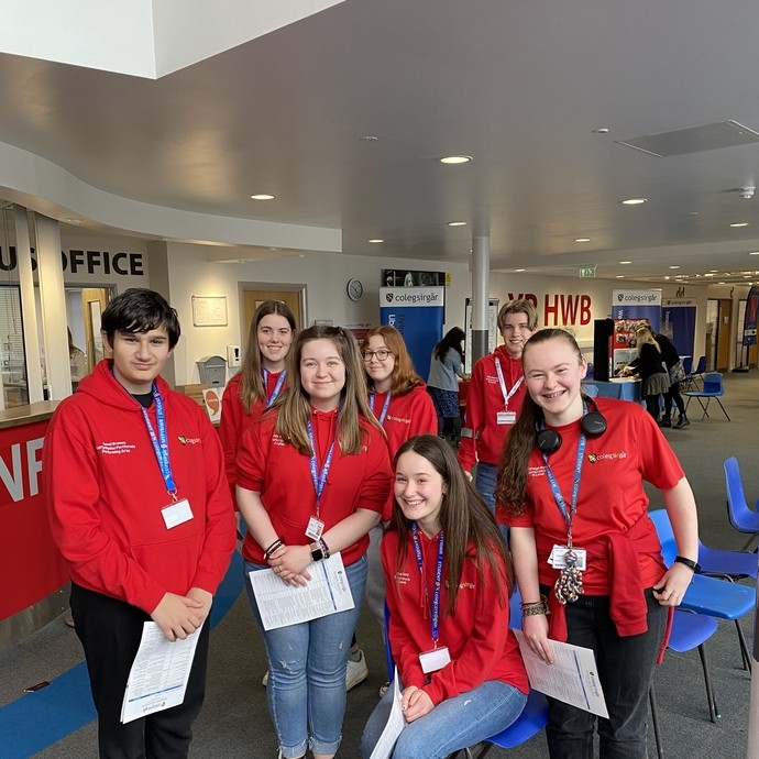 A group of student ambassadors in their red ambassador hoodies.