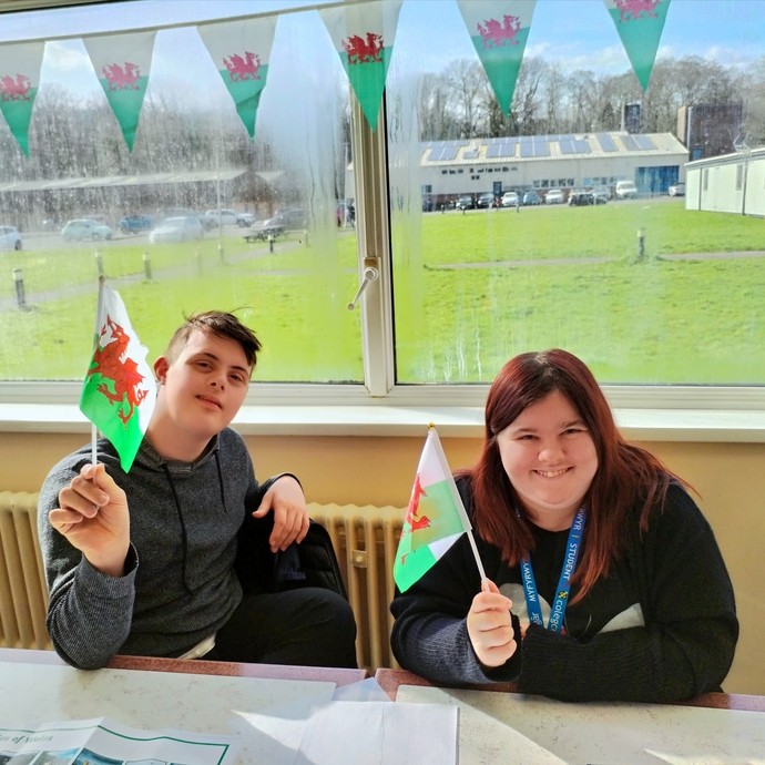 Two students with Welsh flags
