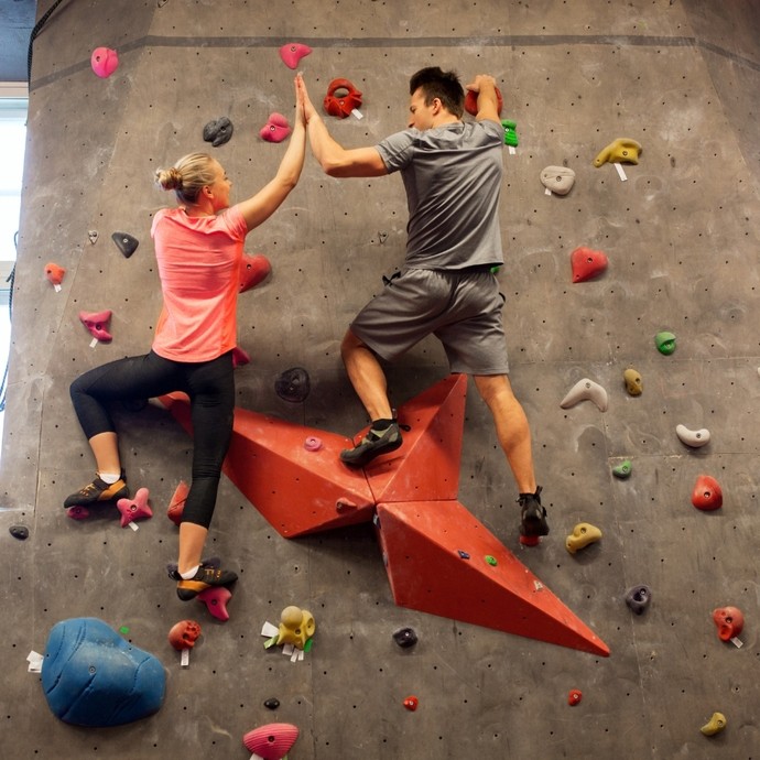 Two students on a climbing wall