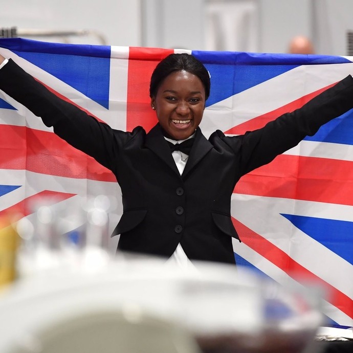 Elizabeth holding up the UK flag 