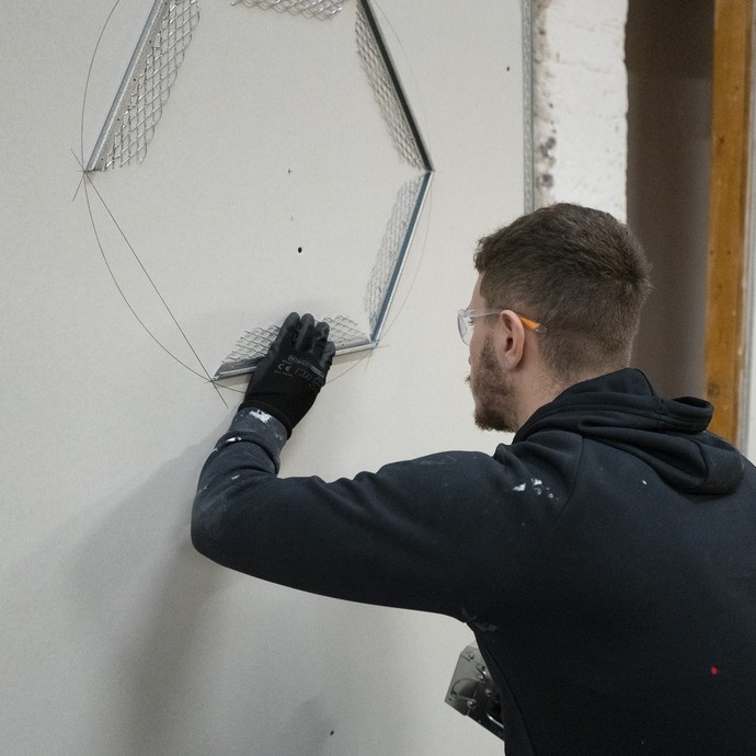 A student plastering