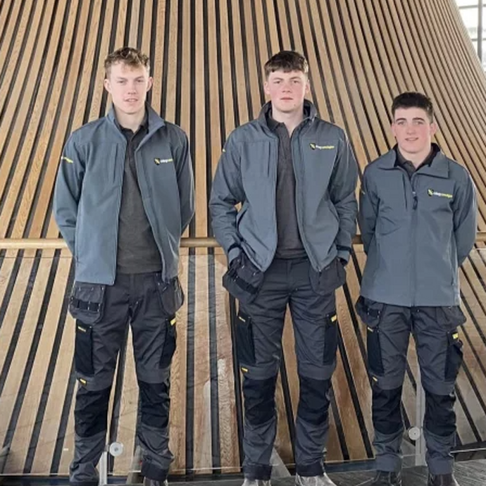 Three construction students in the Senedd