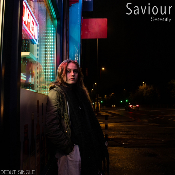 Poppy's album cover which is her standing in the dark under neon sign and window