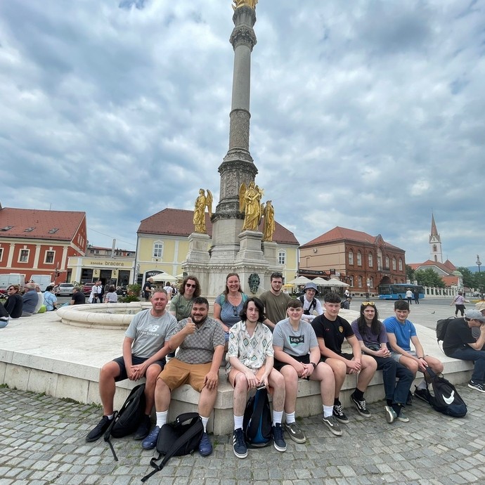 Students gathered around a monument