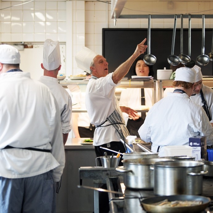 Student chefs in white uniforms